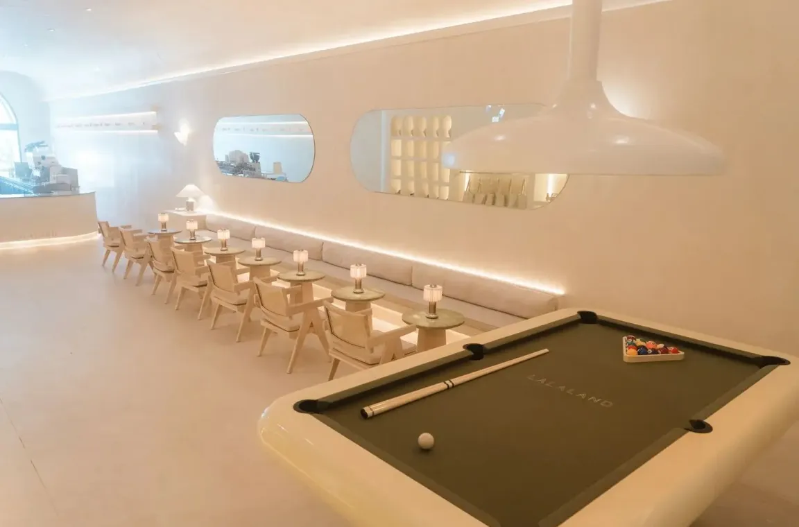 A La La Land store's seating area, with a pool table in the foreground.