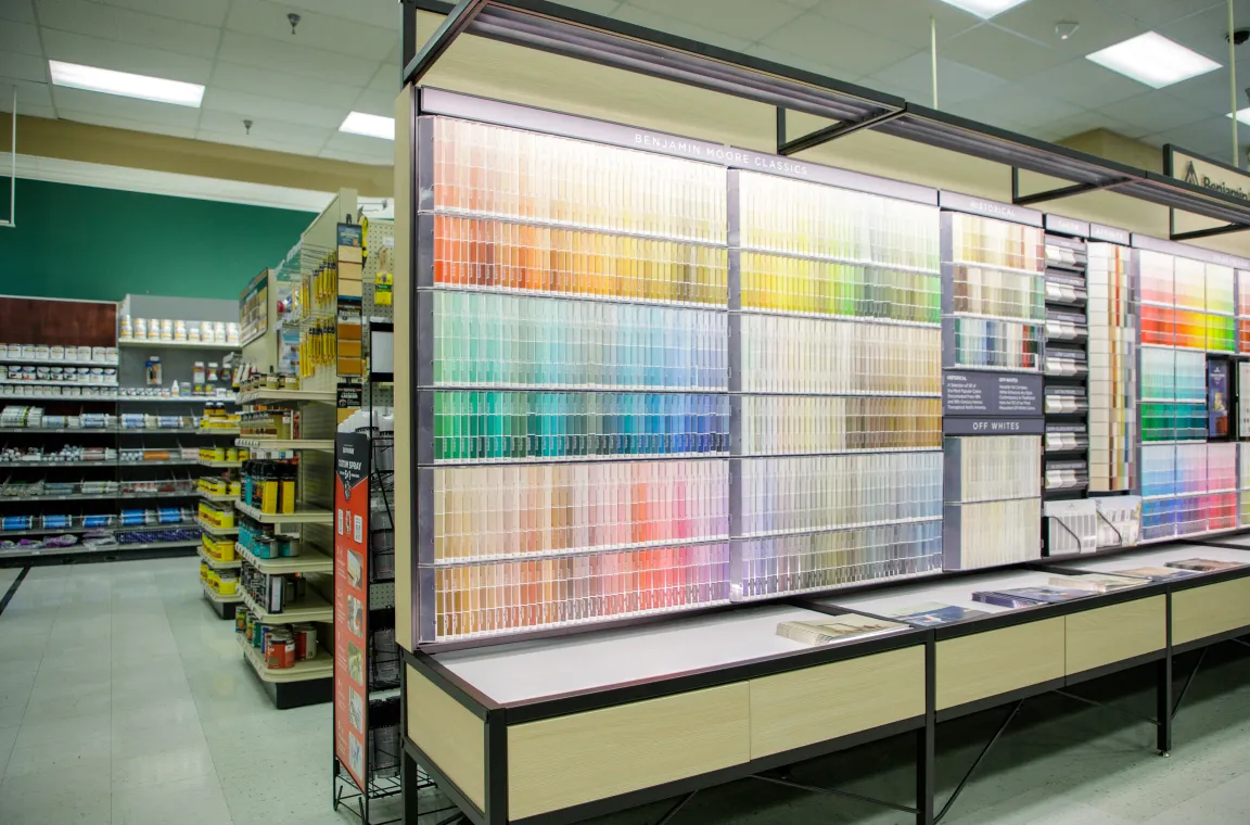 Benjamin Moore paint color selection wall inside Bering's Hardware & Gifts featuring hundreds of paint sample swatches.