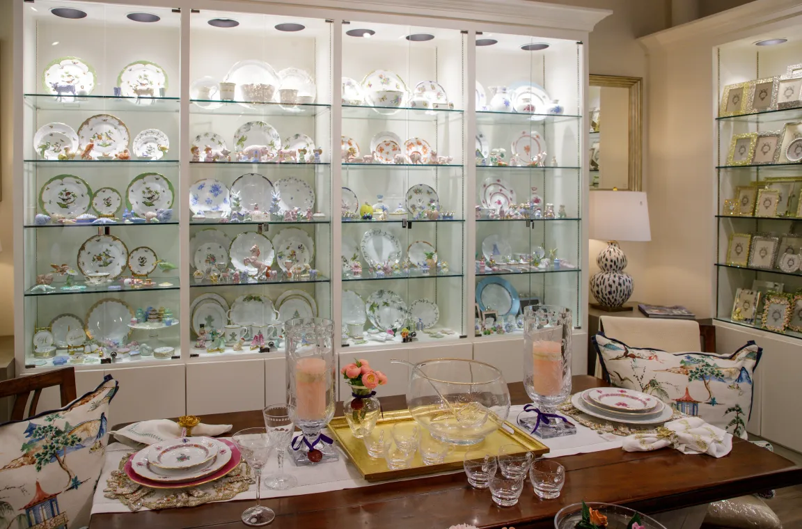 Home décor and tabletop display inside Bering's Hardware & Gifts featuring fine china, decorative plates, glassware, and elegant table settings.