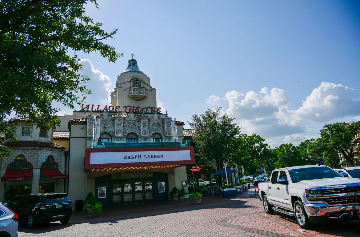 Historic Village Theatre marquee at Highland Park Village in Dallas with Ralph Lauren signage beneath the restored Spanish Colonial facade.