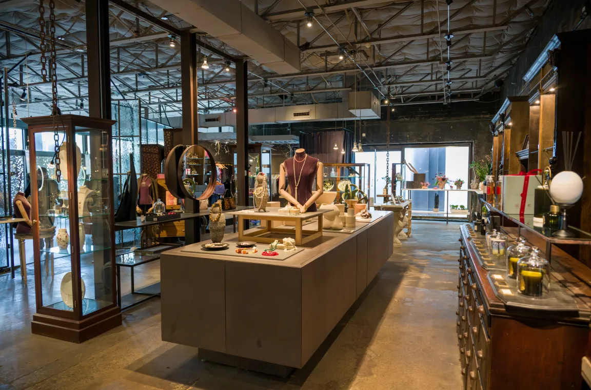 Wide view of Grange Hall's artisan marketplace in Dallas, featuring handcrafted jewelry, home goods, and gifts displayed throughout a spacious industrial-inspired boutique.
